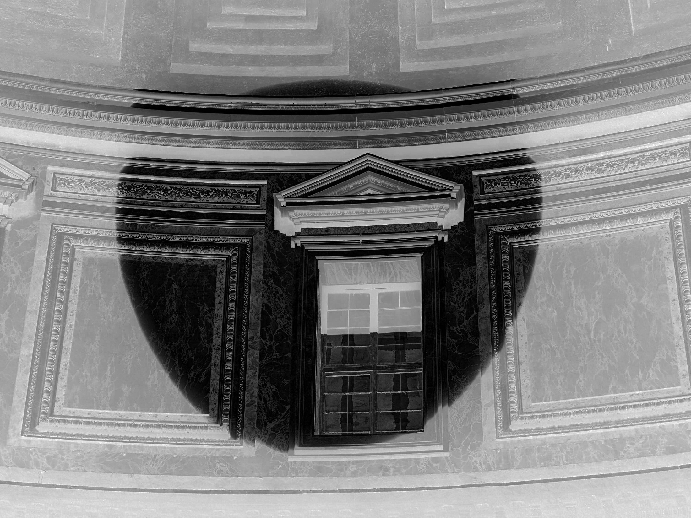 An upward view inside a domed building showing a pedimented window and coffered walls, with a circular shadow cast by the oculus.